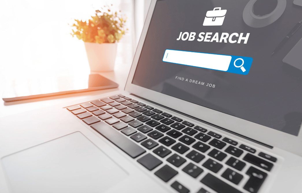 Laptop screen with Kazi Cloud job search interface, showing text 'JOB SEARCH' and 'FIND A DREAM JOB', representing free job posting sites in Kenya.